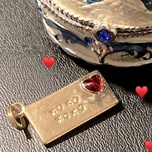 Xoxo miniature gold-toned envelope pendant. A great gift for Valentines Day!